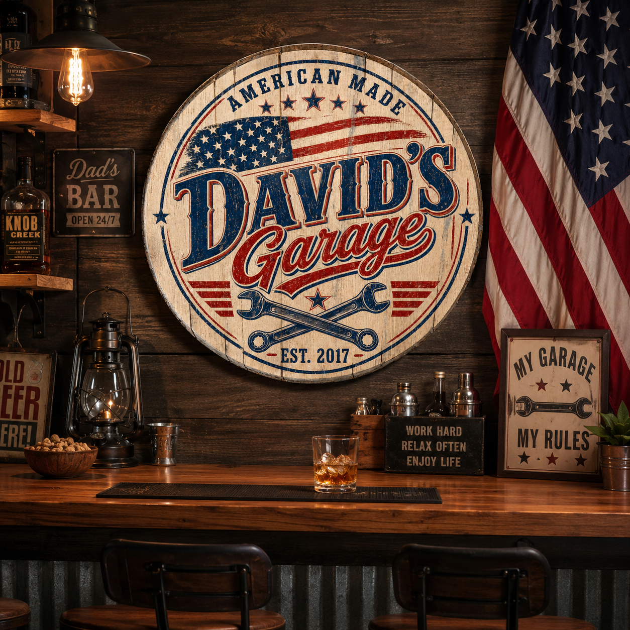 David's Garage personalized patriotic barrel lid sign in a rustic home bar setting