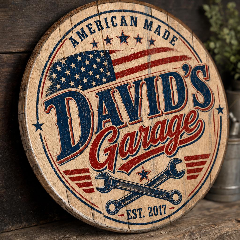 Close up of David's Garage patriotic bourbon barrel lid sign showing distressed wood grain and EST. 2017