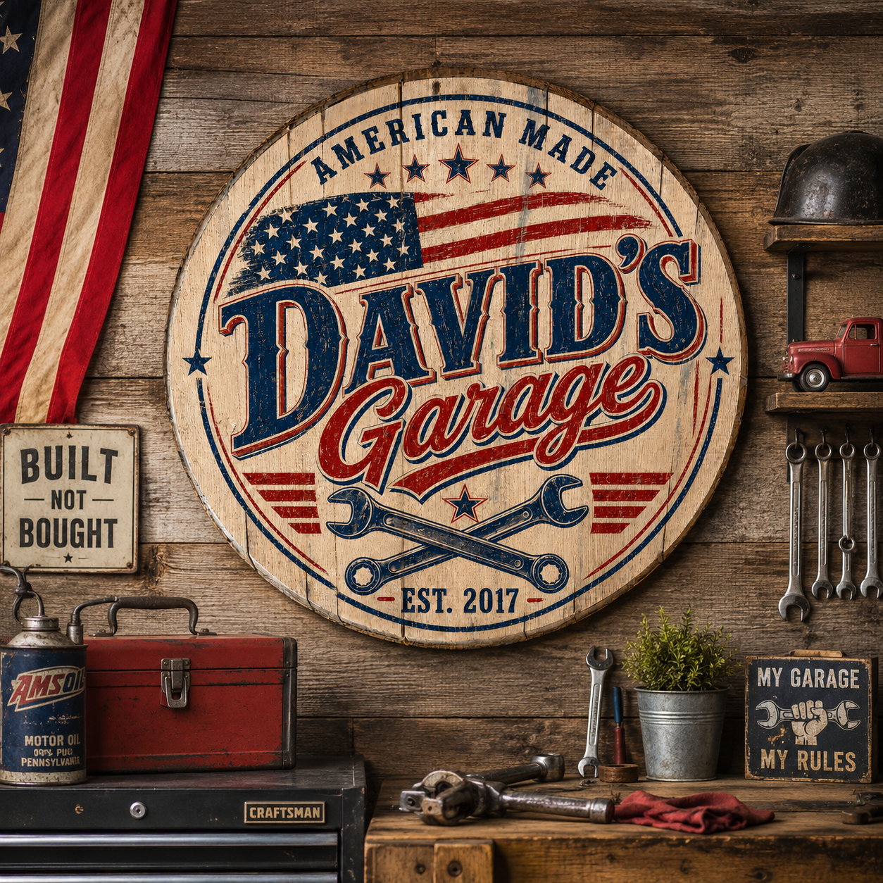 David's Garage personalized patriotic barrel lid sign displayed on a rustic workshop wall